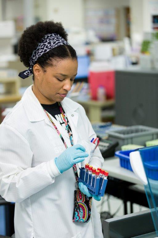 Female scientist holding test tubes